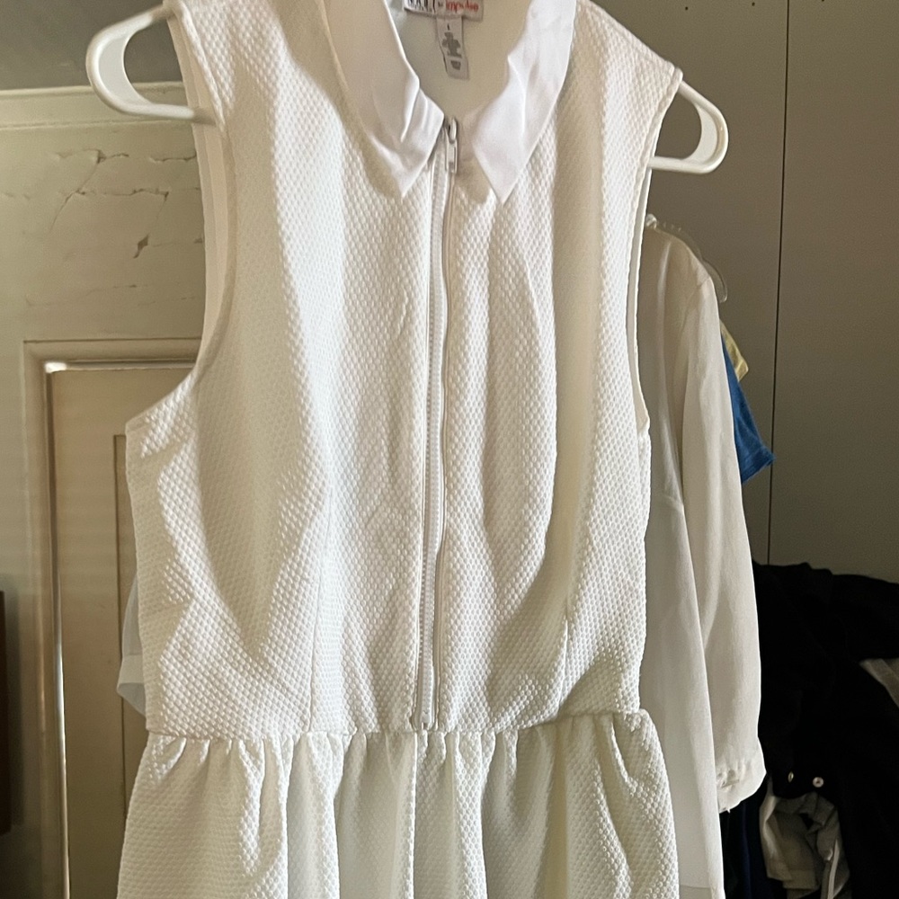 Vintage white dress with no sleeves. Bought new and worned once.